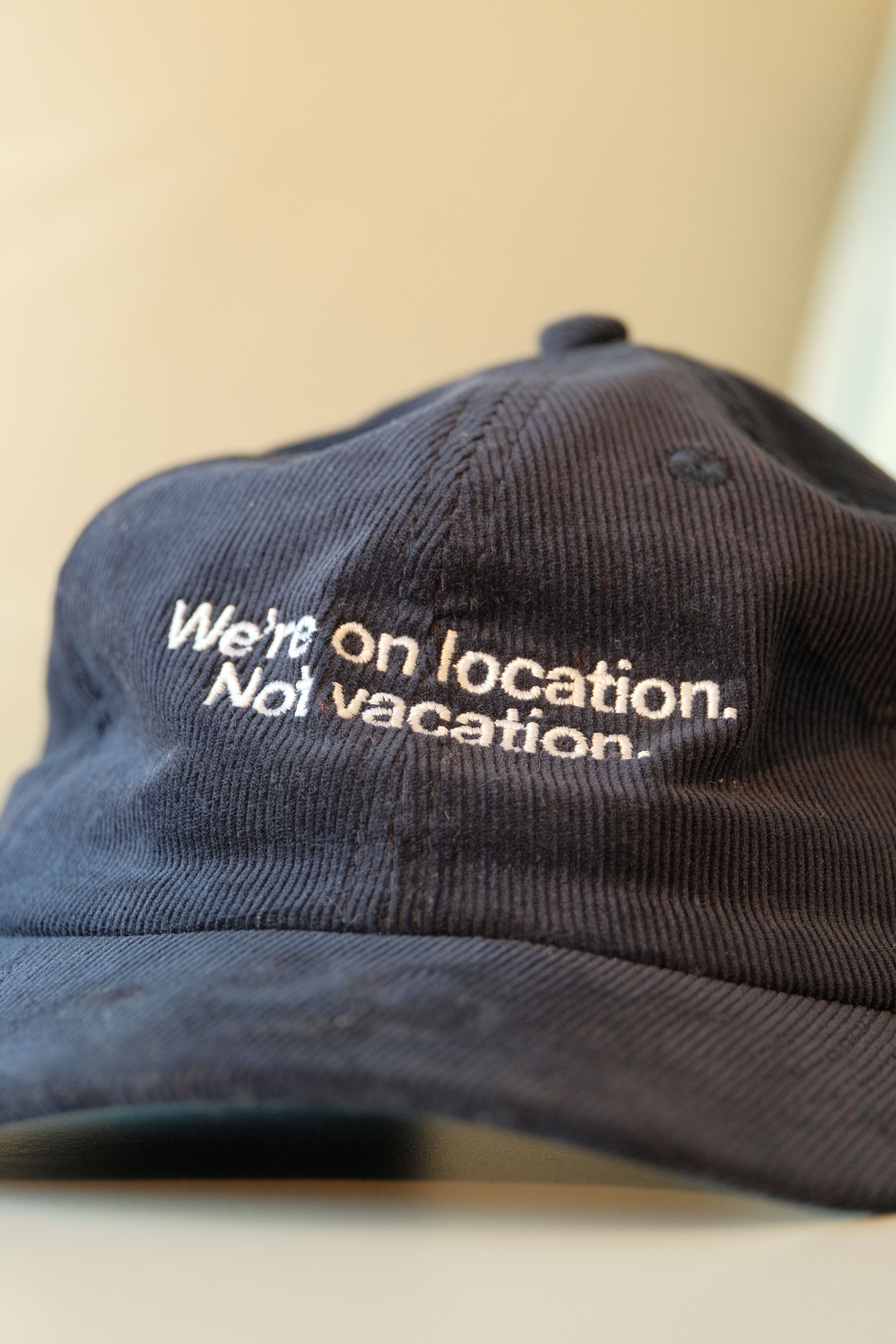 We're on location. Not vacation. Dad Hat